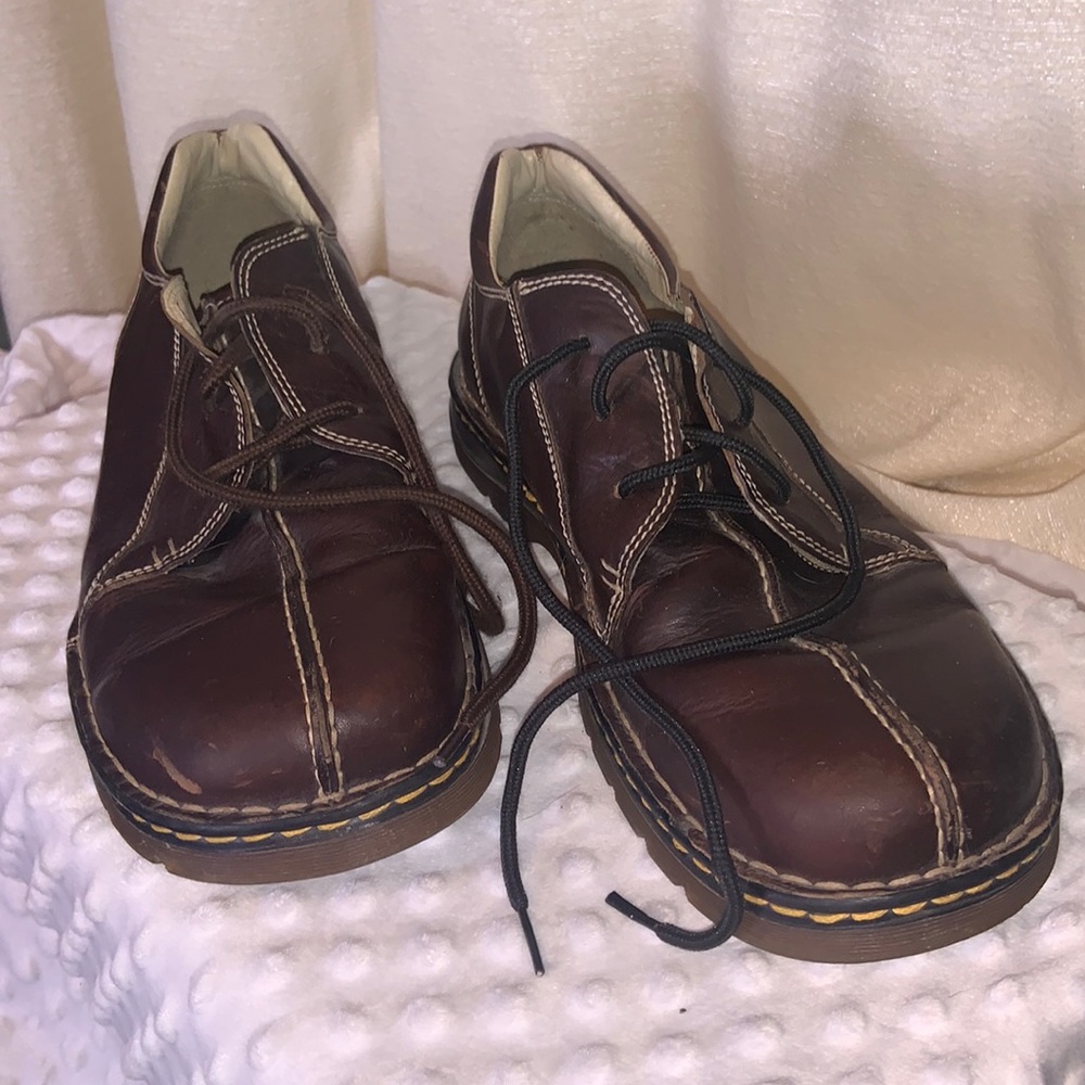 Dr. Martens brown (mismatched laces), some wear on the outer edge of heel